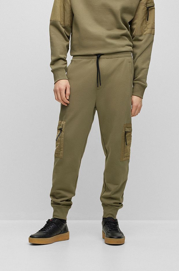 Cotton-terry tracksuit bottoms with cargo pockets, Khaki