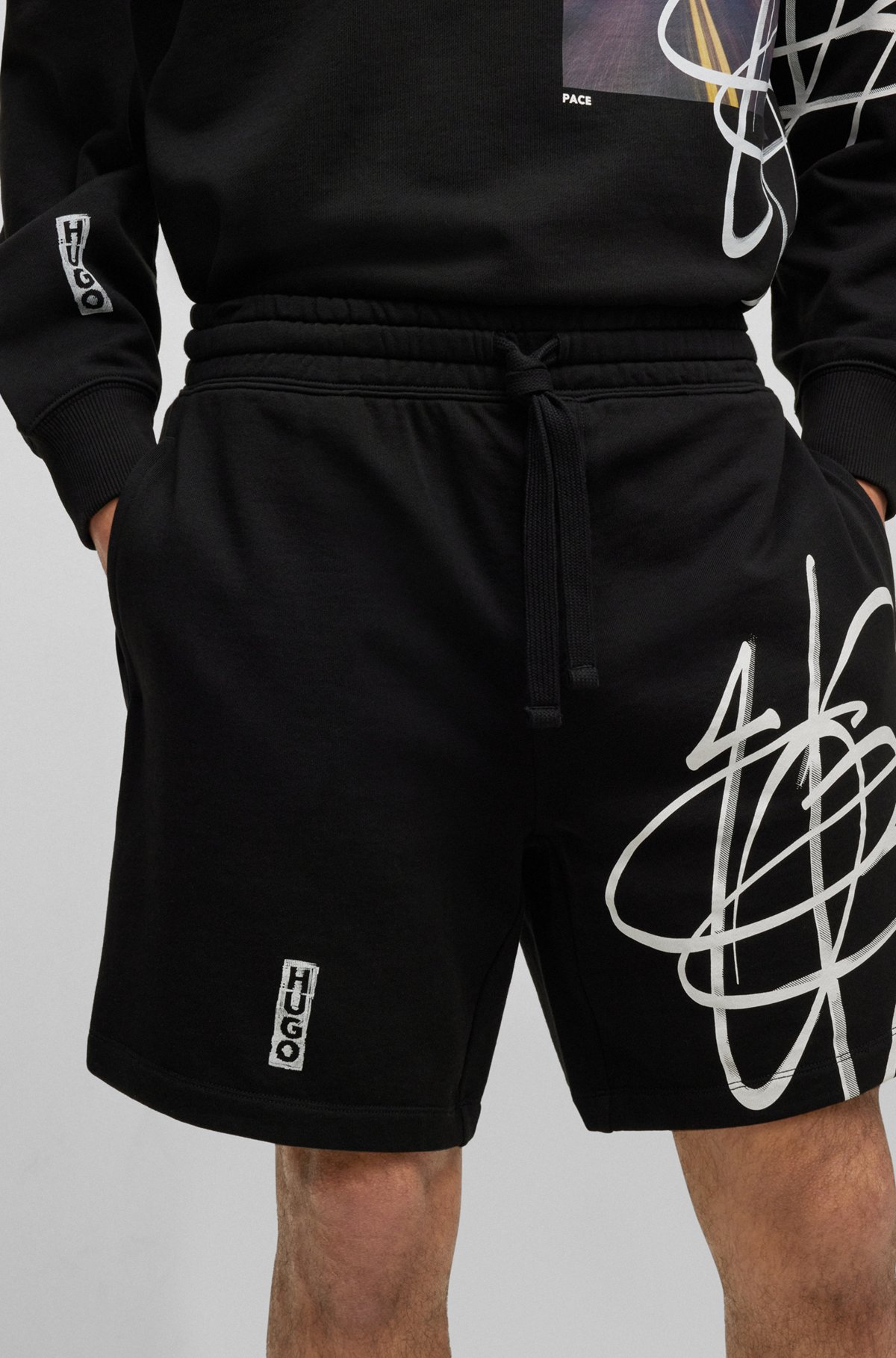 Relaxed-fit cotton shorts with graffiti-inspired logo, Black