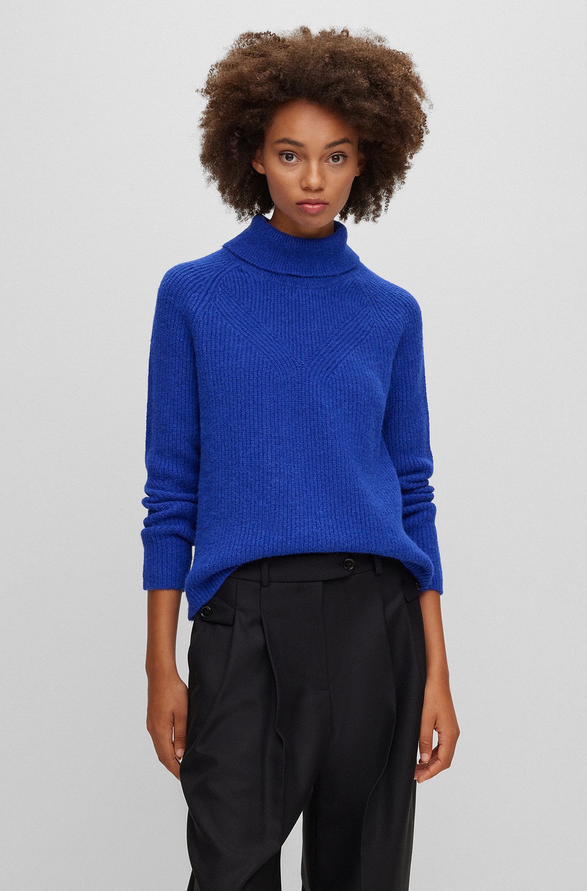 Rollneck sweater with mixed structures, Blue