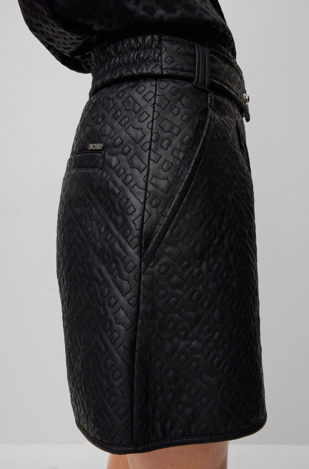 Relaxed-fit shorts in monogram-embossed faux leather, Black