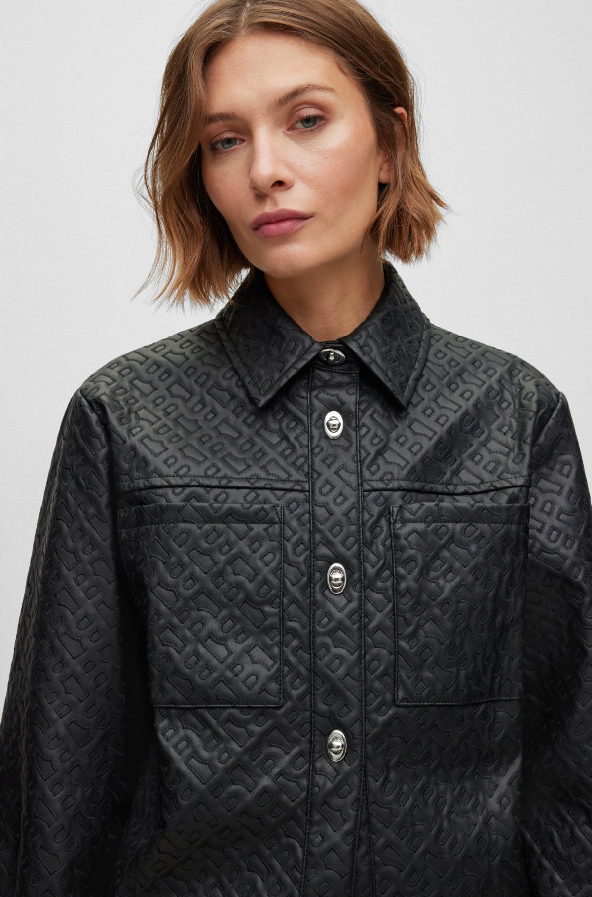 Transparant In detail kop BOSS - Regular-fit blouse van imitatieleer met monogramreliëf
