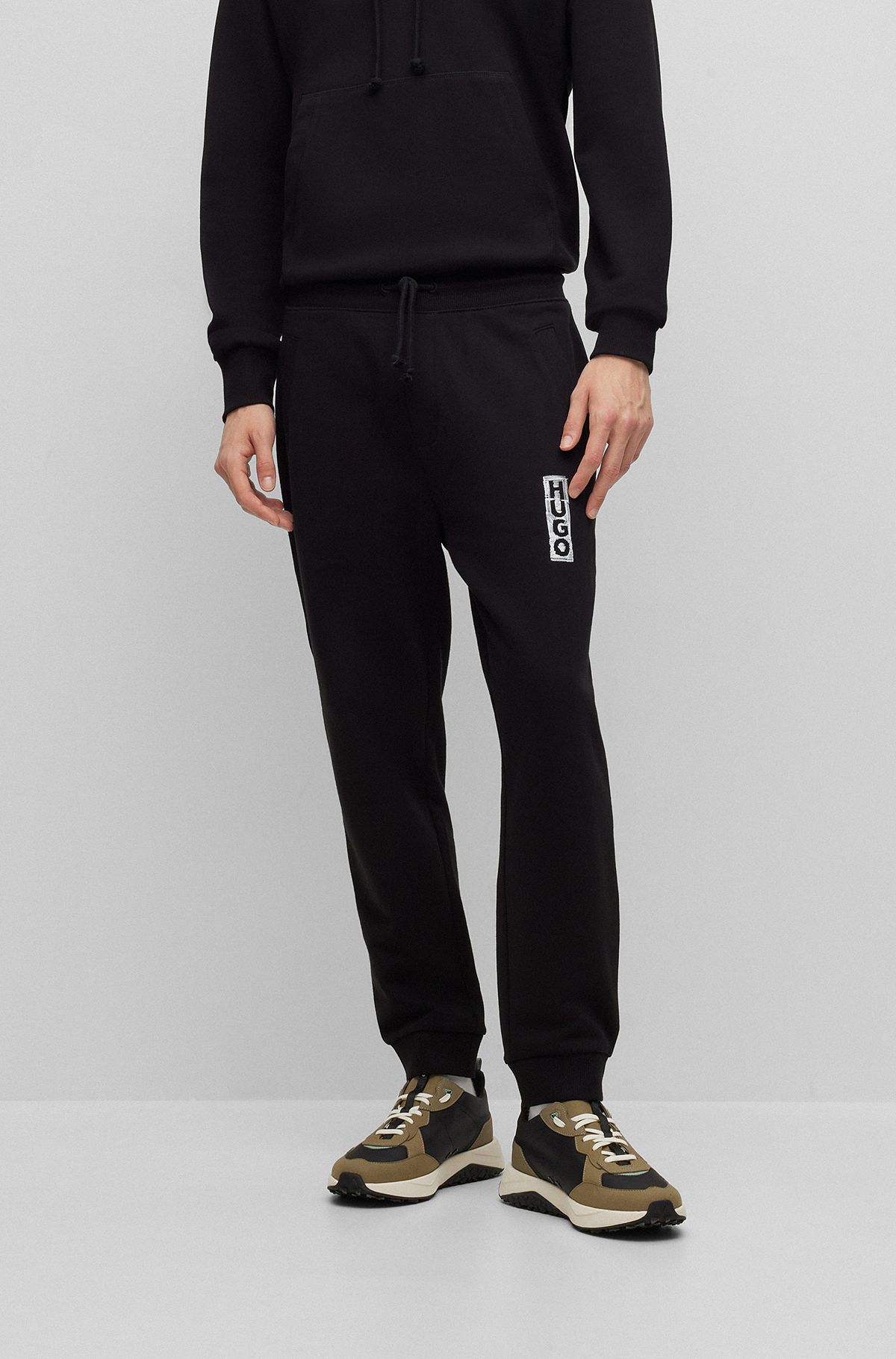 HUGO - Cotton-terry tracksuit bottoms with handwritten logo embroidery