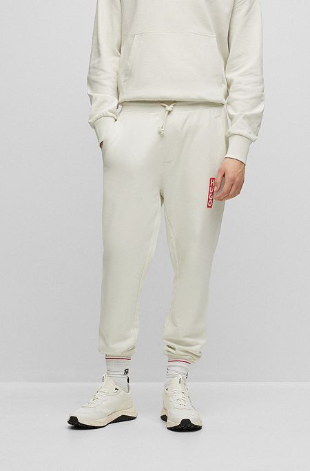 Cotton-terry tracksuit bottoms with vertical logo, Light Beige