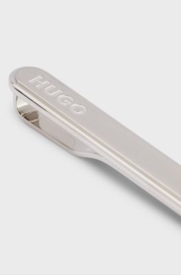 Oval-shaped tie clip with engraved logo, Silver tone