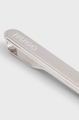 Oval-shaped tie clip with engraved logo, Silver tone