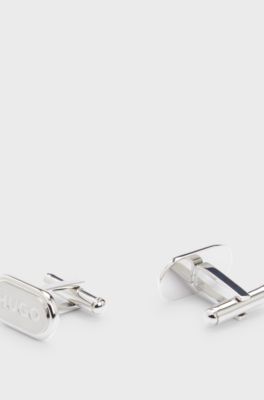 Oval-shaped cufflinks with engraved logos, Silver tone