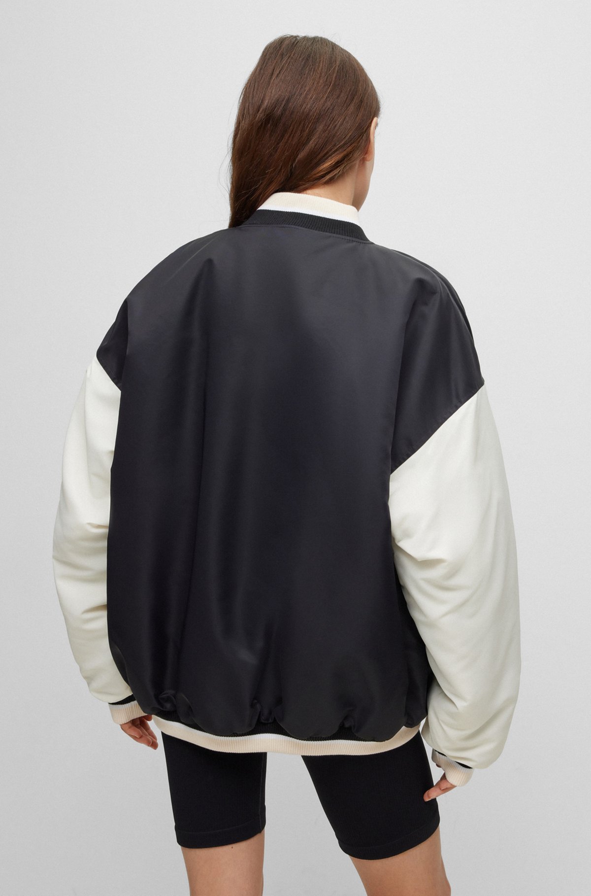 Water-repellent varsity-style bomber jacket with logo badge, White / Black