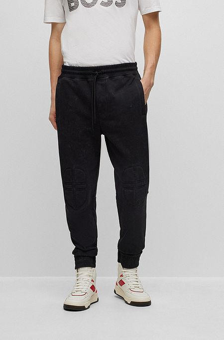 Relaxed-fit cotton tracksuit bottoms with racing-inspired details, Black