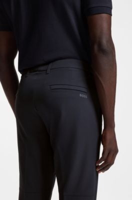 Regular fit-byxor i vattenavst&ouml;tande stretchmaterial, M&ouml;rkbl&aring;