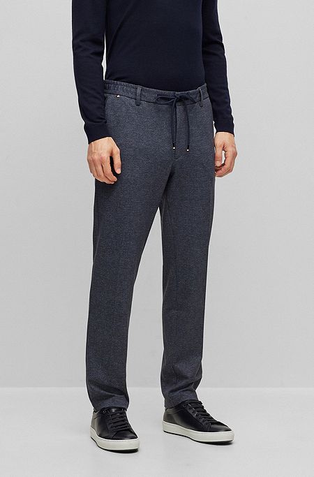 Pantalones regular fit de punto elástico con estampado en formato macro, Azul oscuro