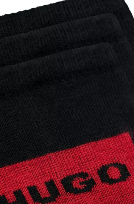 Three-pack of invisible socks with red logo labels