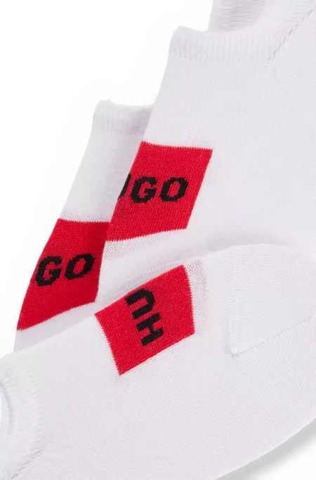 Three-pack of invisible socks with red logo labels