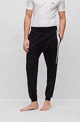Organic-cotton tracksuit bottoms with stripes and logo, Black
