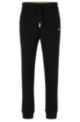Regular-fit tracksuit bottoms with multi-colored logos, Black