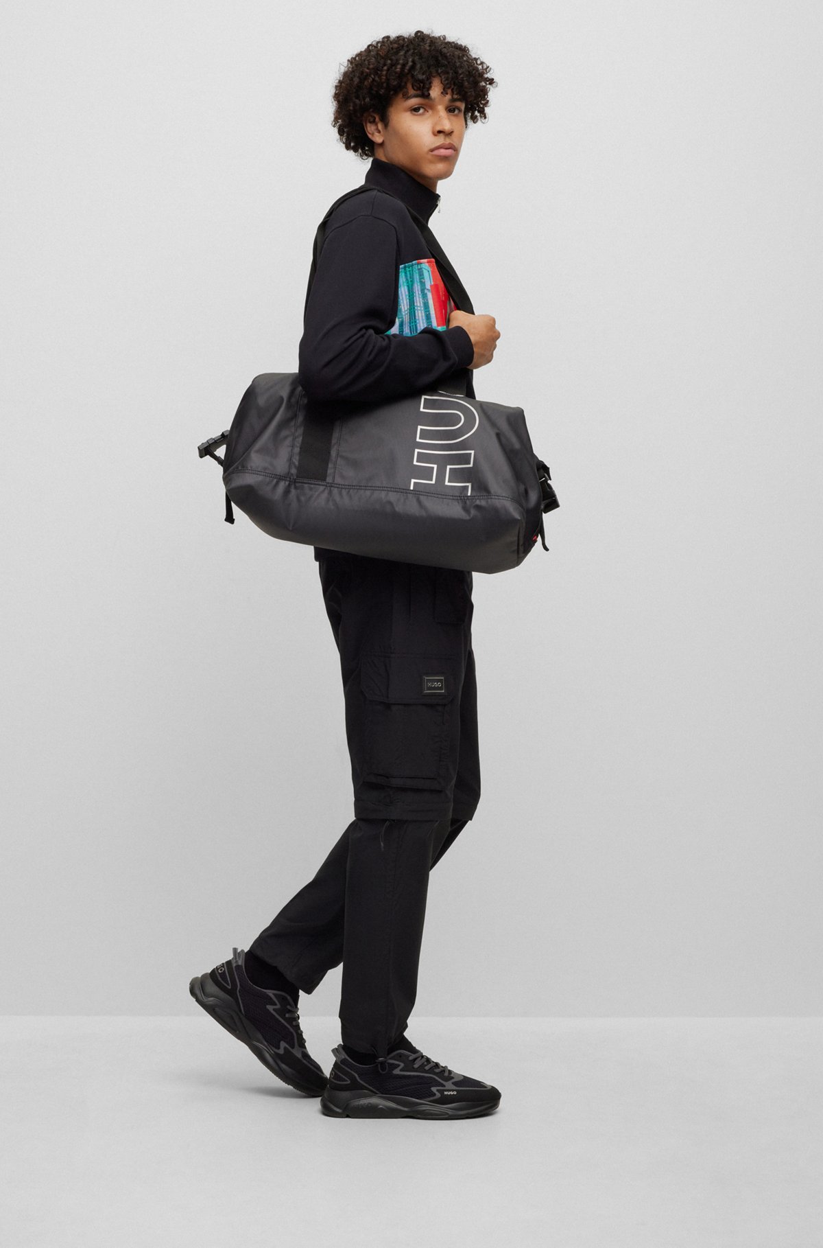 Outline-logo holdall in diamond-structured material, Black