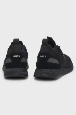 Sneakers van verschillende materialen met gebreide bovenzijde en su&egrave;de details, Zwart