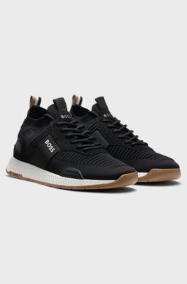 Sneakers aus verschiedenen Materialien mit gestricktem Obermaterial und Veloursleder-Details, Schwarz