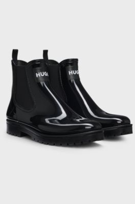 Glanzende regenlaarzen met elastiek en logopatch, Zwart