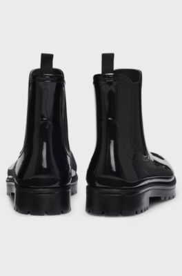 Gl&auml;nzende Chelsea-Regenstiefel mit Logo-Patch, Schwarz