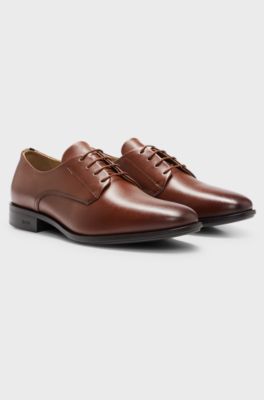 Chaussures derby en cuir avec finitions embl&eacute;matiques, Marron