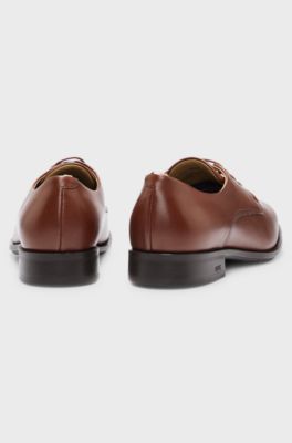 Chaussures derby en cuir avec finitions embl&eacute;matiques, Marron