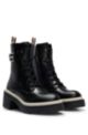 Chunky-sole leather boots with branded metal detail, Black