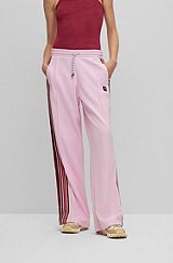 Jersey tracksuit bottoms with logo and tape trims, light pink