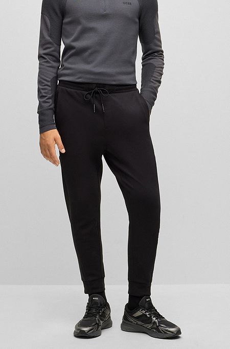 Cotton-blend tracksuit bottoms with embossed logo, Black