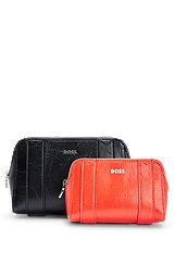 Two textured cosmetic cases with logo details, Black
