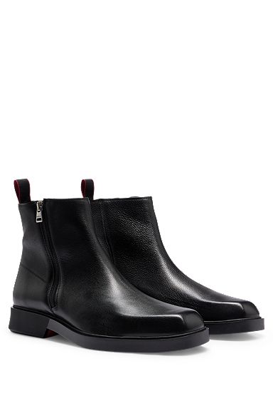 Ankle boots in grained leather with signature details, Black