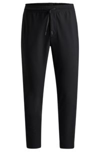 Tapered-fit trousers in waterproof softshell material, Black