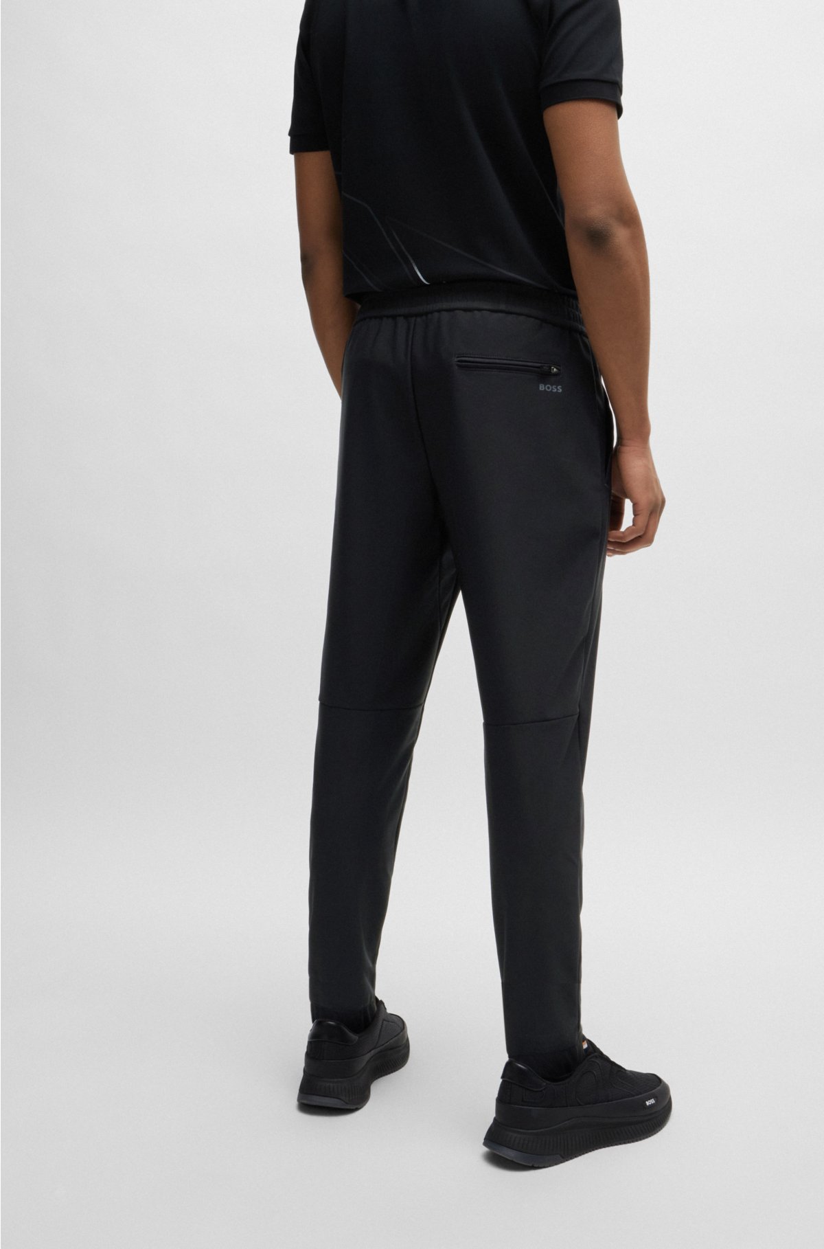 Tapered-fit trousers in waterproof softshell material, Black