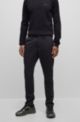Pantalones regular fit en material de membrana softshell impermeable, Negro