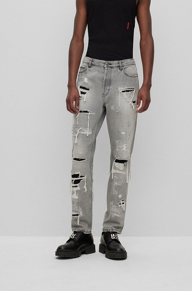 Jeans con fit affusolato in denim grigio-argento molto usurato, Grigio chiaro