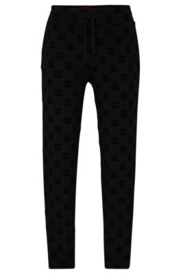 HUGO - Straight-leg tracksuit bottoms with flock-print stacked logos