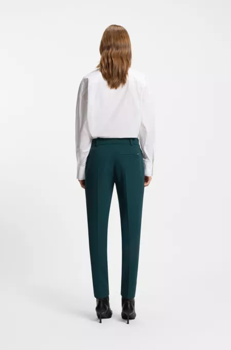 Slim-fit trousers with slit hems