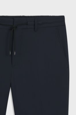 Pantaloni slim fit in jersey elasticizzato ad alte prestazioni, Blu scuro