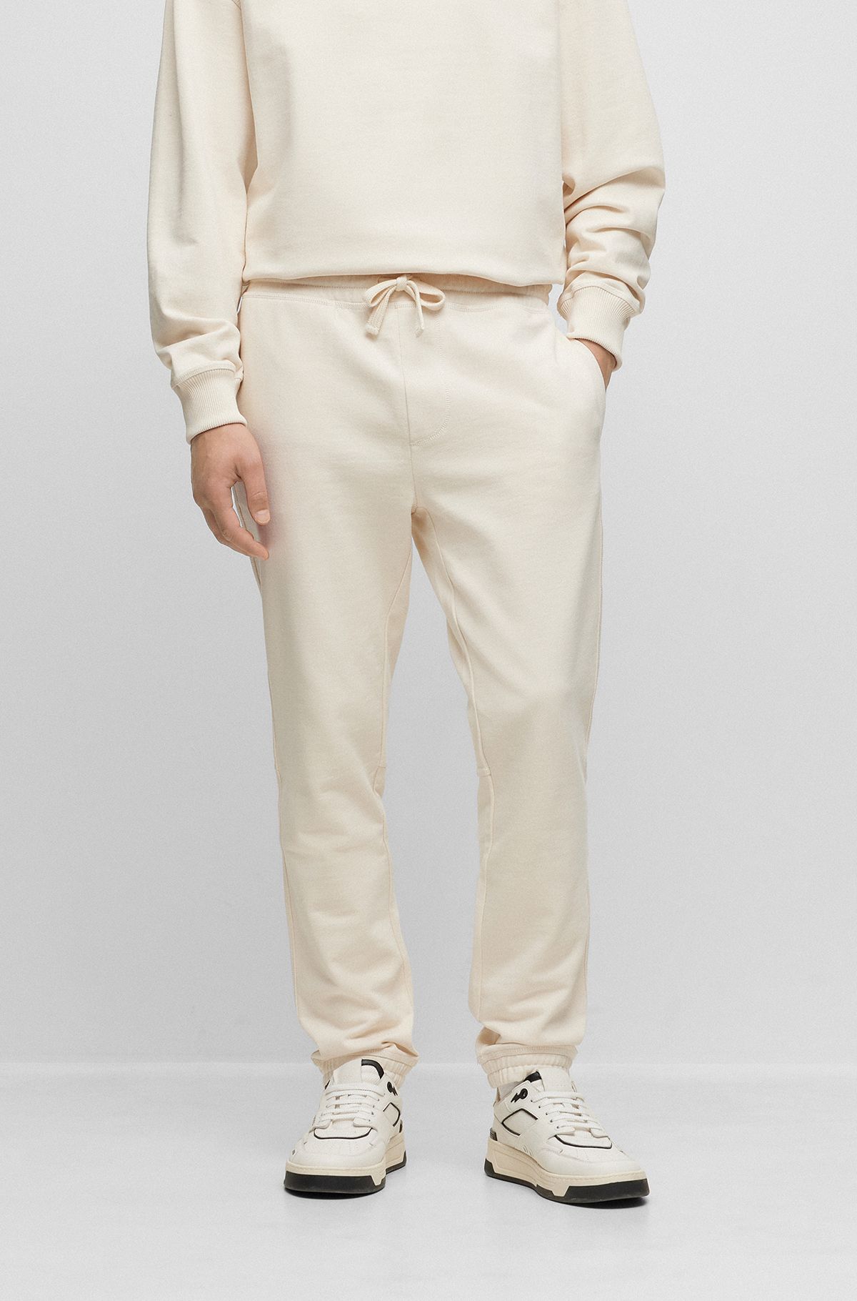 Relaxed-fit tracksuit bottoms in French-terry cotton, Natural