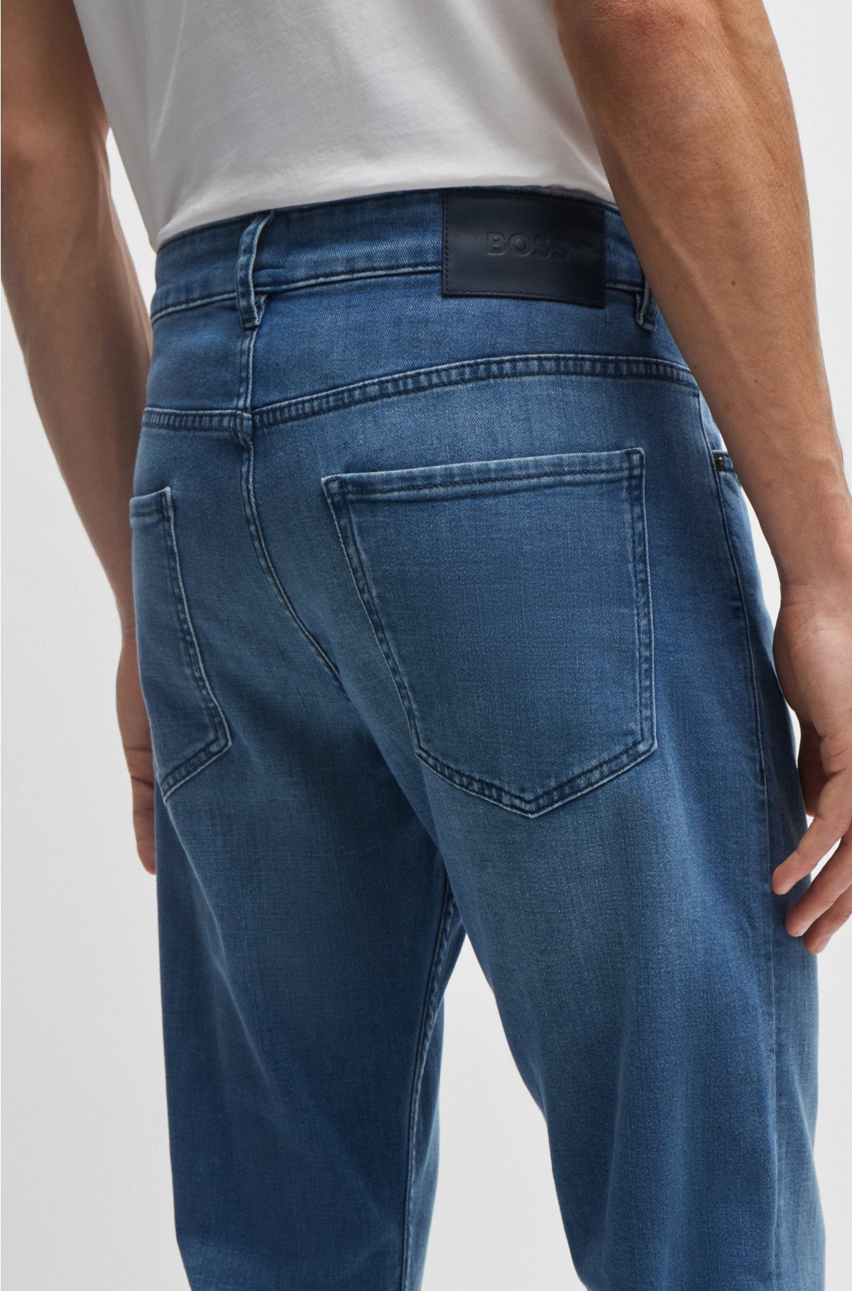 BOSS - Tapered-fit jeans in blue stretch denim