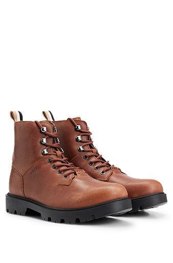 Half boots in pull-up leather with embossed logo, Brown