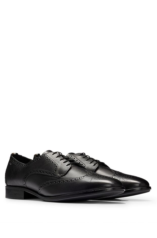 Derby shoes in leather with brogue details, Black