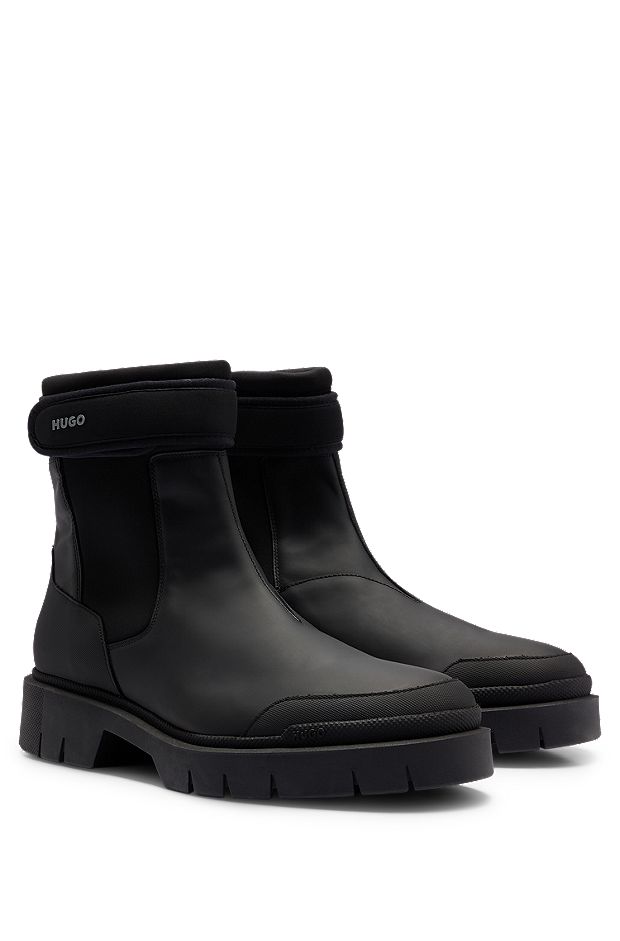 Logo-strap Chelsea boots in rubberised leather, Black