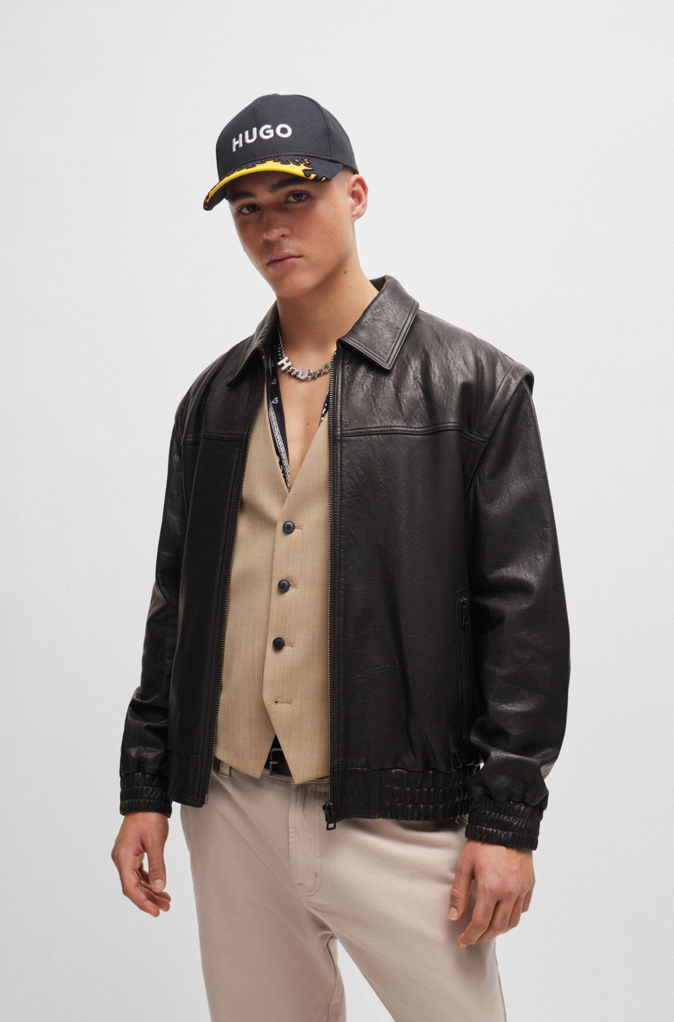 HUGO - Leather jacket with detachable sleeves and stud artwork