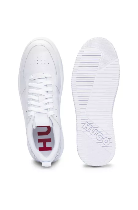 Mixed-material trainers with raised logo