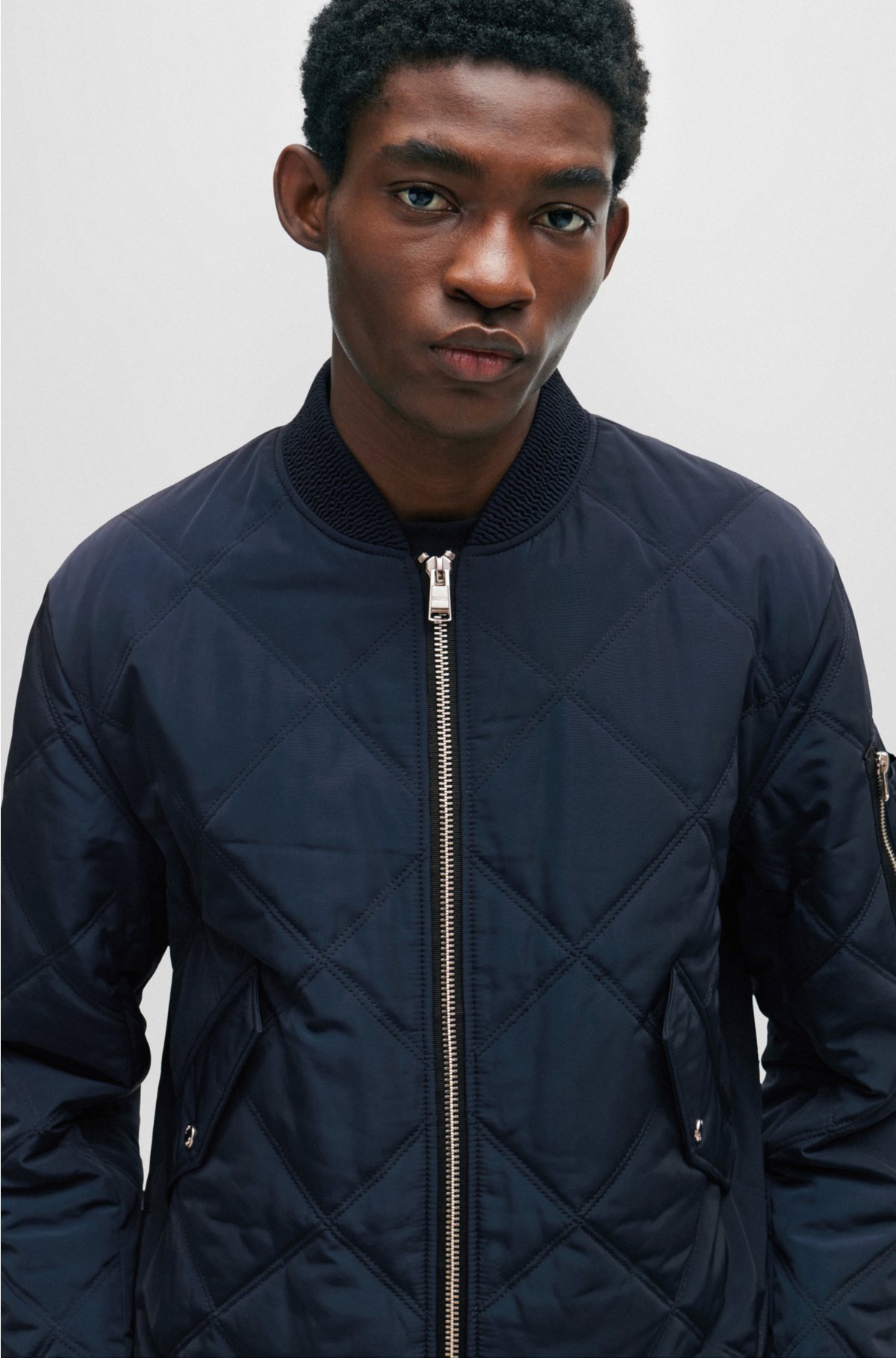 BOSS - Quilted regular-fit jacket with branded sleeve pocket