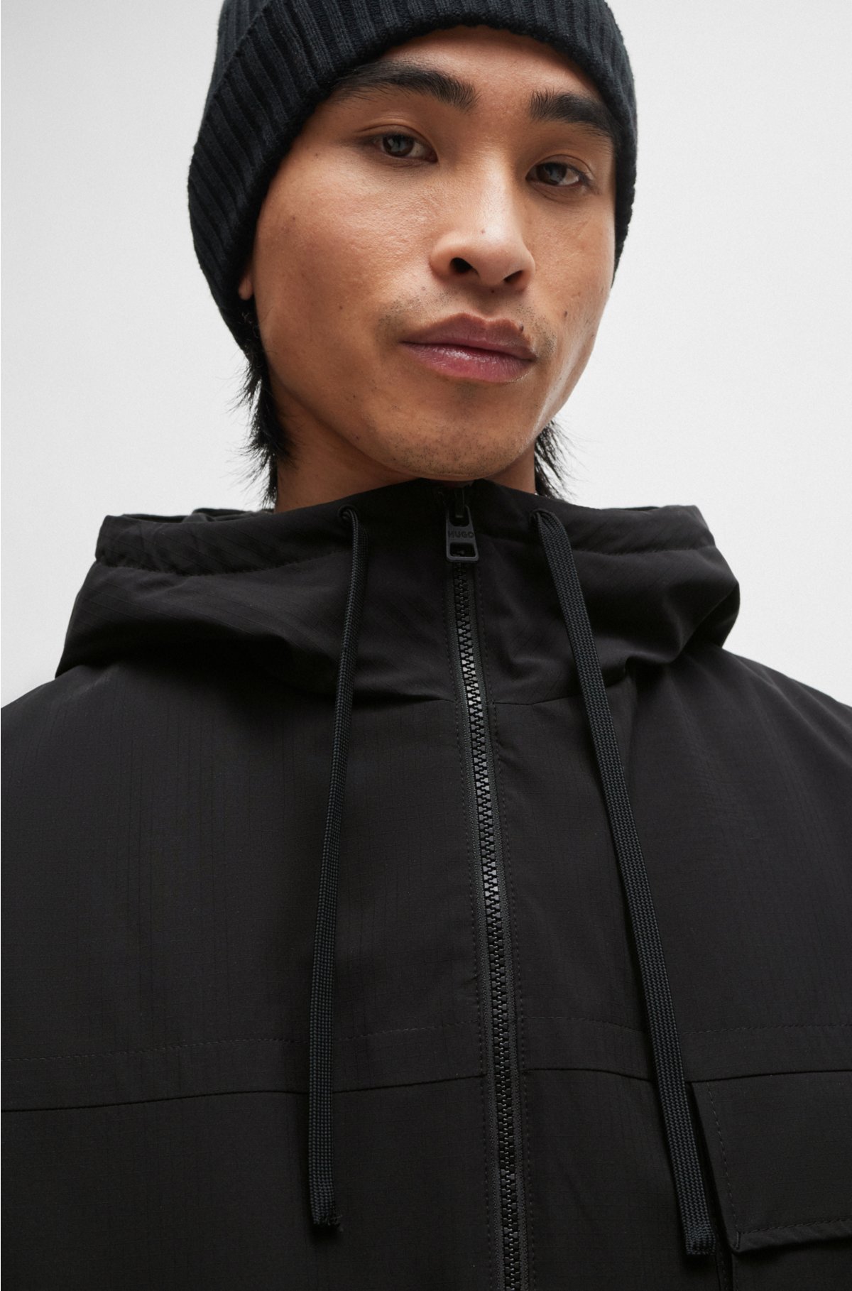 Water-repellent parka jacket with stacked-logo buckle, Black