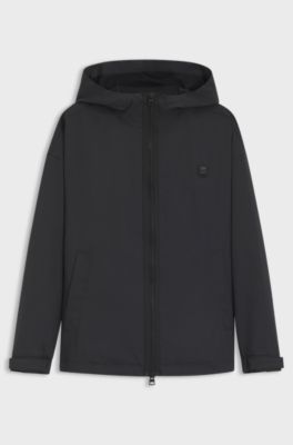 Water-repellent hooded windbreaker with stacked-logo badge, Black