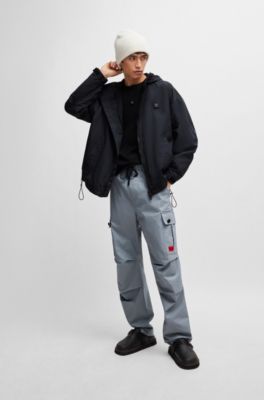 Water-repellent hooded windbreaker with stacked-logo badge, Black