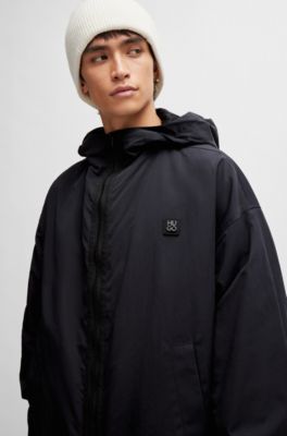 Water-repellent hooded windbreaker with stacked-logo badge, Black