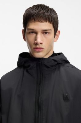 Water-repellent hooded windbreaker with stacked-logo badge, Black
